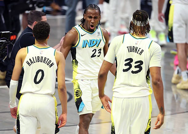 Tyrese Haliburton, Aaron Nesmith, and Myles Turner of the Indiana Pacers celebrate after beating the Milwaukee Bucks 123-115 in Game Two of the...