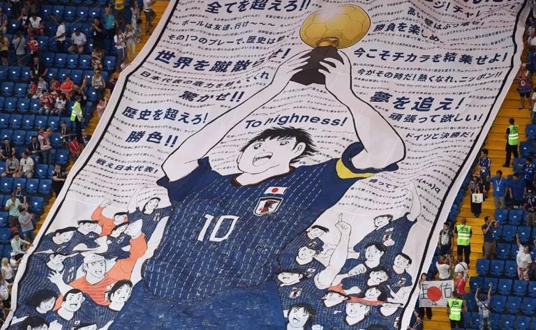 A 'Captain Tsubasa' banner floats in the stands of a Japan national team game. (Photo: Twitter)