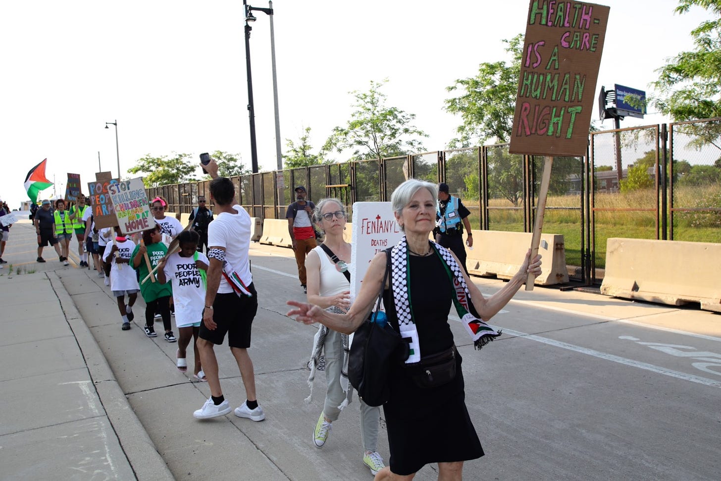 Jill Stein, Green Party presidential candidate, carries a sign in the Poor People's March as it approaches Fiserv Arena, site of the Republican Convention. (Vic Hinterlang / Shutterstock.com)