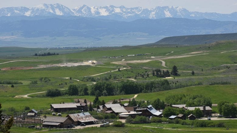 A ranch in a valley. A ranch in a valley.