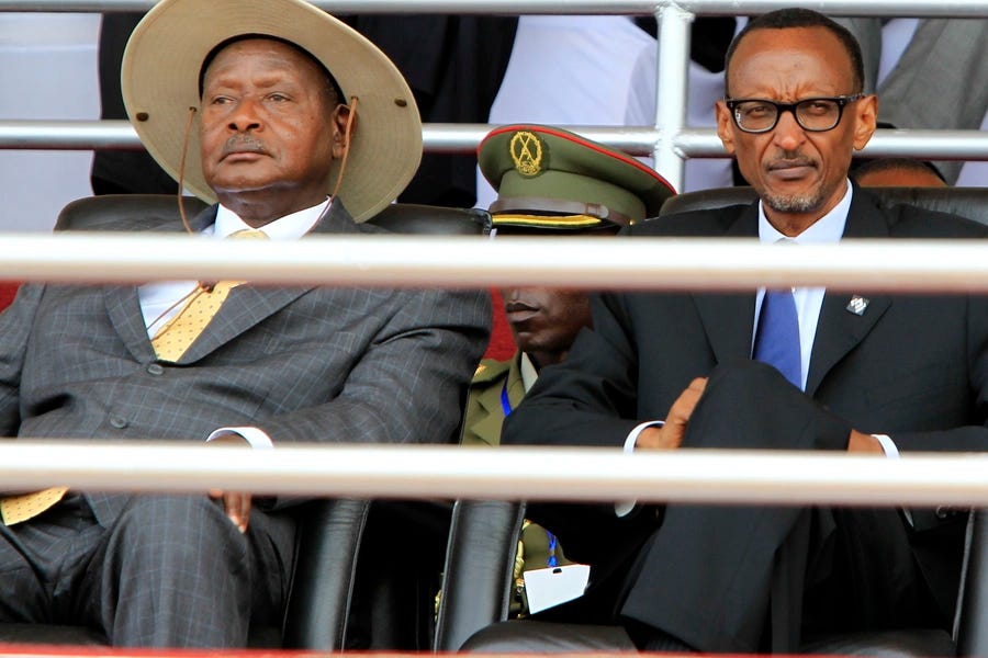 Rwandan President Paul Kagame (R) and his Ugandan counterpart Yoweri Museveni follow the proceedings of the 20th anniversary commemoration of the Rwandan genocide, in Kigali, Rwanda, on April 7, 2014.