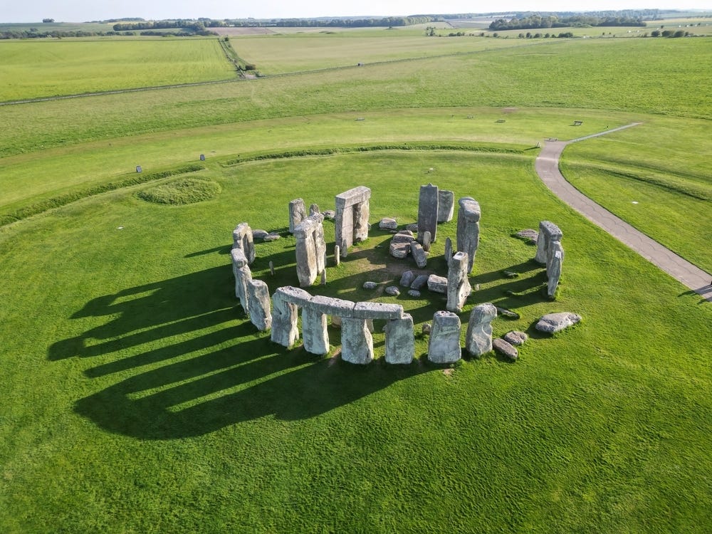 May be an image of Stone Henge and grass