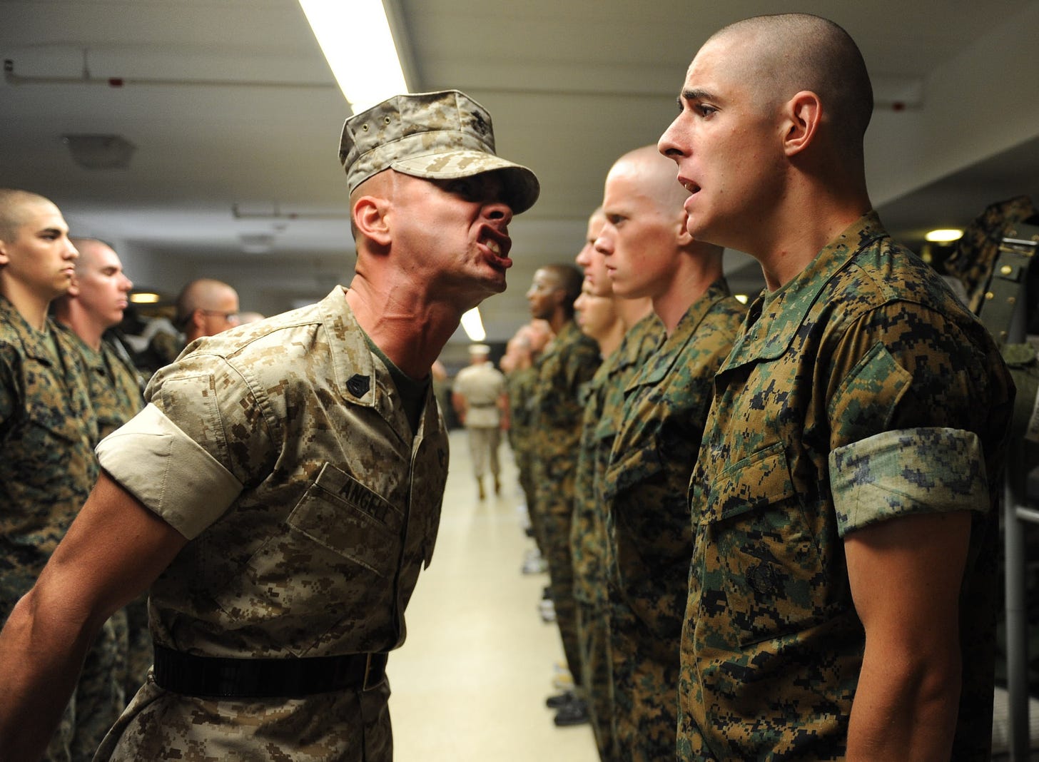 A drill sargent yelling at other solders 