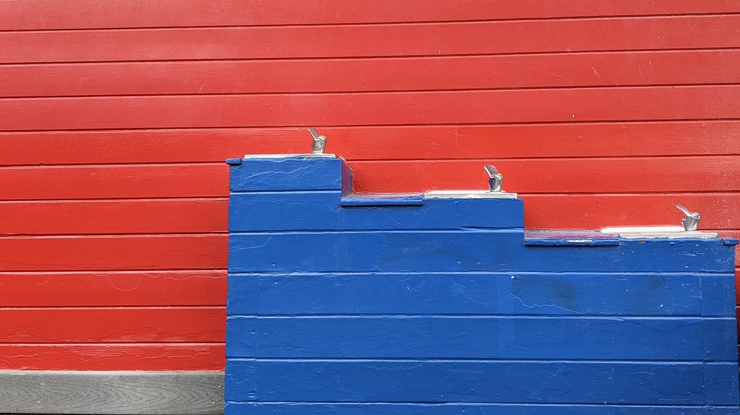 a wall painted half red and half blue