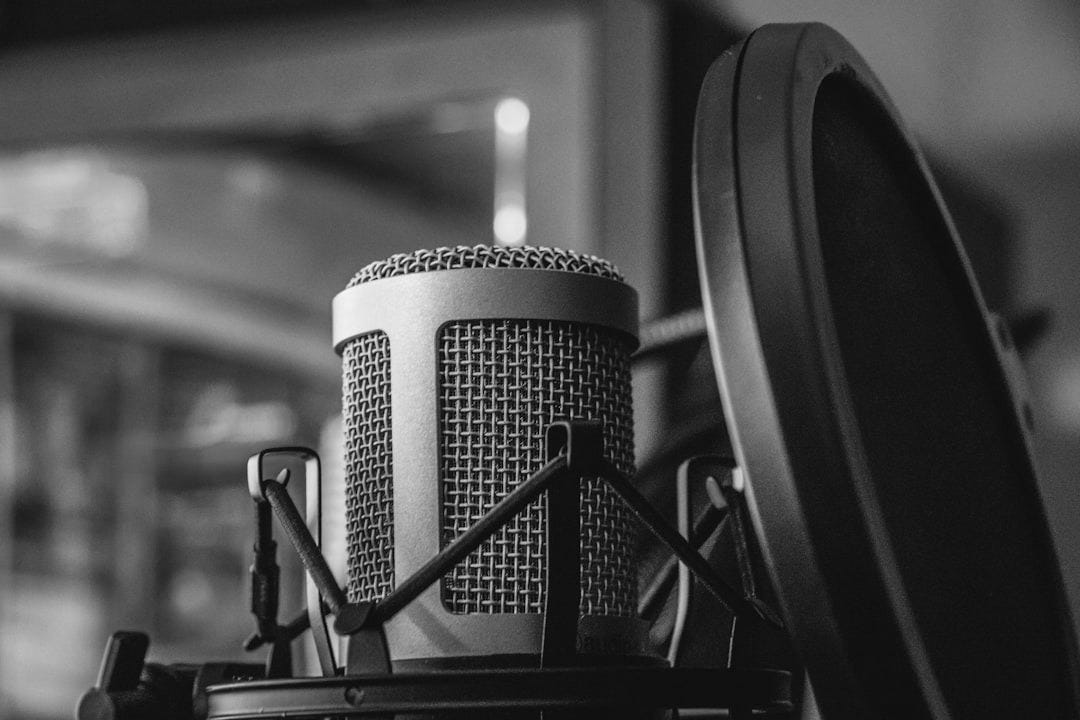 gray microphone beside of condenser