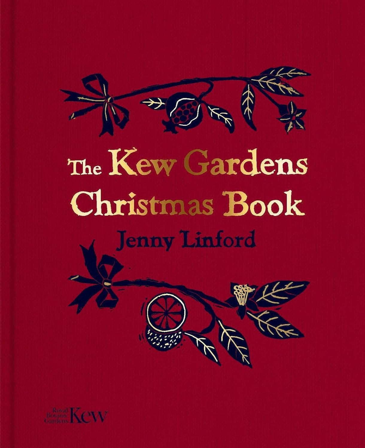 A dark red cloth-feel hardback book embossed gold title and an artists illustration of Christmas foliage