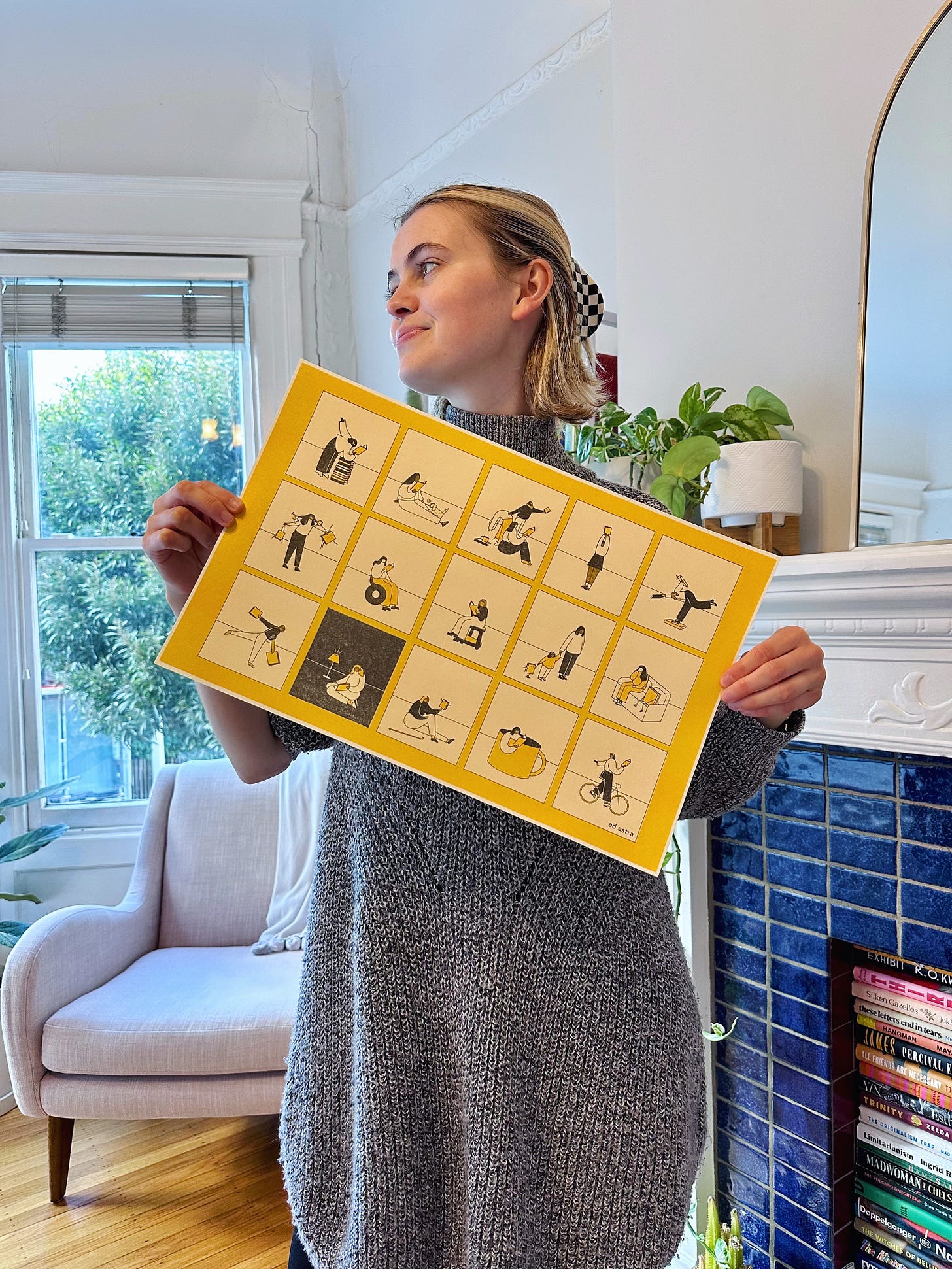 A blonde woman holds a print showcasing vignettes of readers in various positions