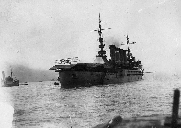 Photo of USS Pennsylvania. Ely's plane can be seen landing on deck.