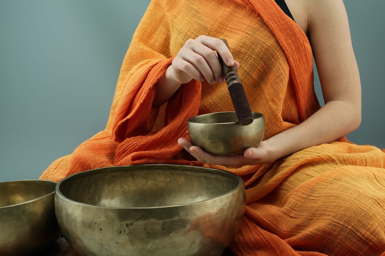 A monk makes a set of bowls sing