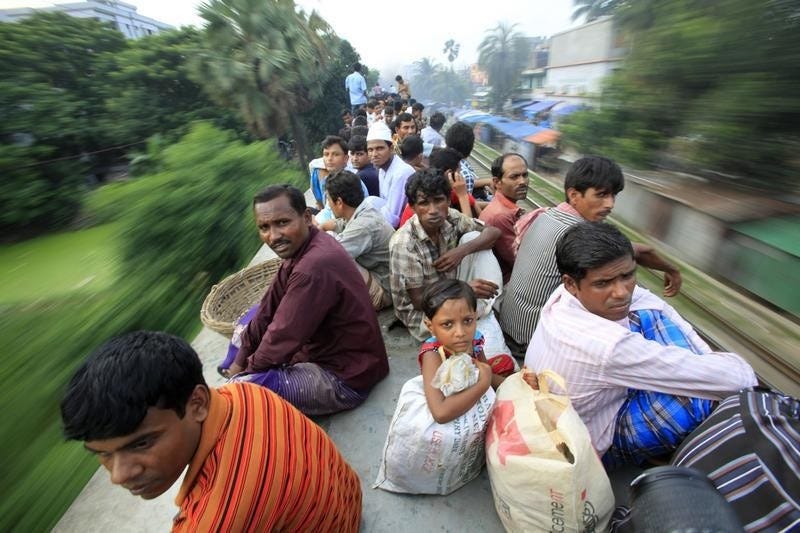 passengers atop an overcrowded train as it heads for Jamalpur from Dhaka, 2012. Photo: Reuters/Andrew Biraj