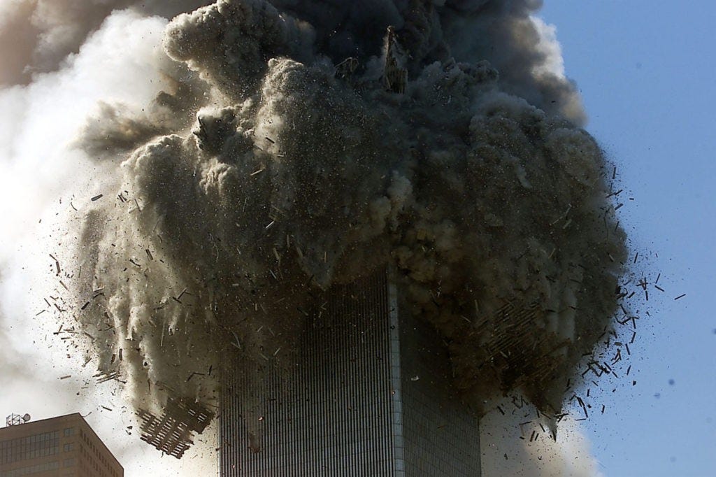 394263 01: (PUERTO RICO OUT) An explosion rocks one of the World Trade Center Towers crumbled down after a plane hit the building. (Photo by Jose Jimenez/Primera Hora/Getty Images)