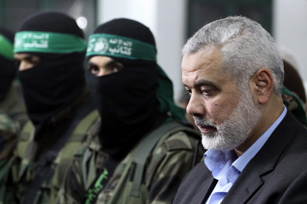 Ismail Haniyeh attends the funeral of released prisoner Majdi Hammad in the northern Gaza Strip, March 19, 2014. Hammad, the brother of Palestinian interior minister in Gaza Strip Fathi Hammad, was one of prisoners released in the Gilad Shalit prisoner exchange agreement between Hamas and Israel. (Photo: Mohammed Asad/APA Images)