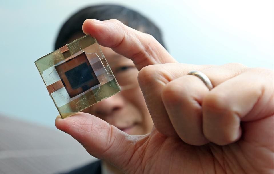 Prof. Charles Chee Surya, poses for a photograph with perovskite-silicon tandem solar cells with the world's highest power conversion efficiency. 12APR16 SCMP/K. Y. Cheng