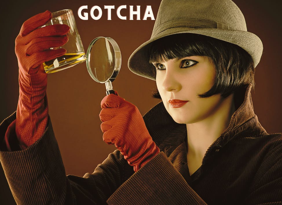 beautiful female detective in red gloves holding magnifying glass up to glass of scotch