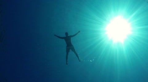 Man floating on water, bottom of the sea... | Stock Video | Pond5