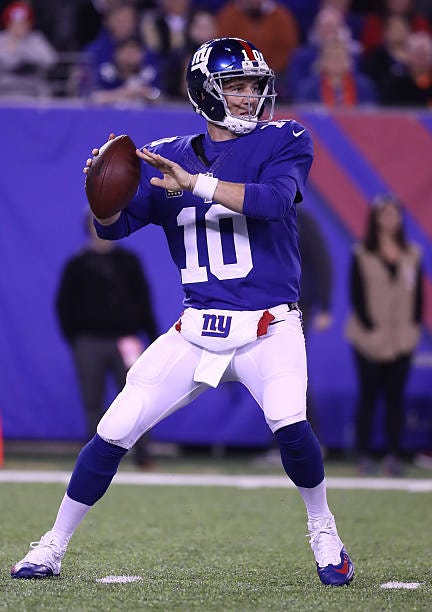 Eli Manning of the New York Giants throws a pass against the Cincinnati Bengals during the first quarter of the game at MetLife Stadium on November...