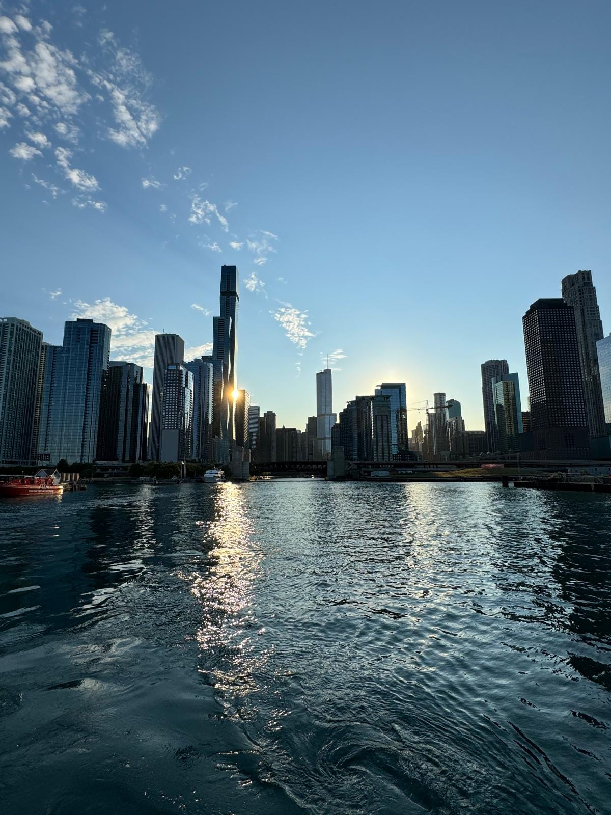 Color photo of the Chicago skyline against a bright blue sky.