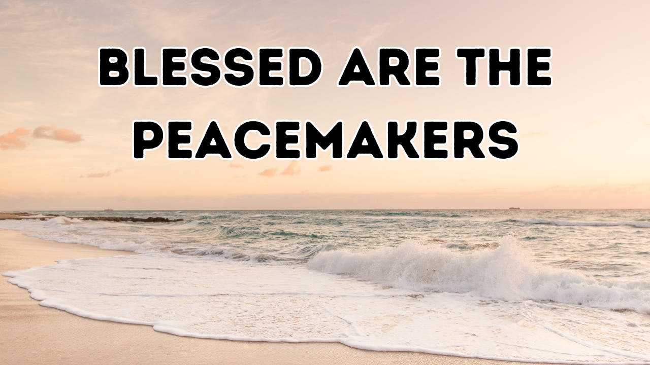 The words "Blessed are the Peacemakers" above ocean waves on the beach.