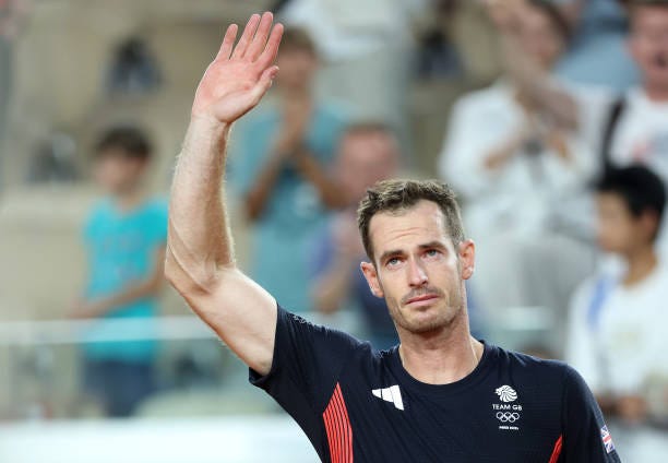 Andy Murray of Team Great Britain acknowledges the crowd with partner Daniel Evans of Team Great Britain after losing match point against Taylor...