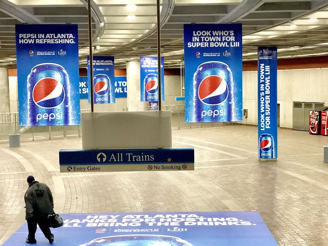 Pepsi ads blanket Atlanta's downtown MARTA station.