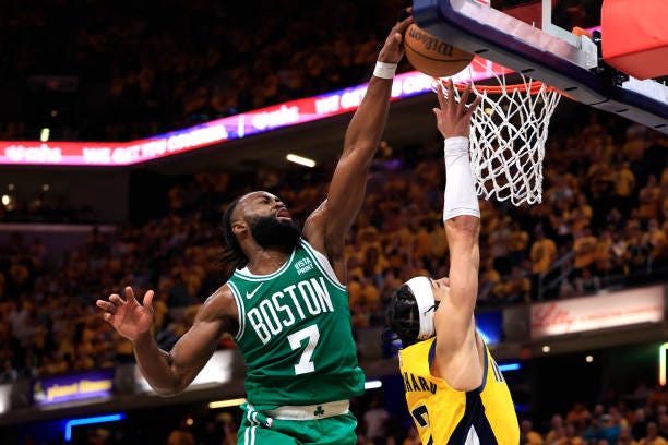 Jaylen Brown of the Boston Celtics blocks Andrew Nembhard of the Indiana Pacers during the fourth quarter in Game Four of the Eastern Conference...
