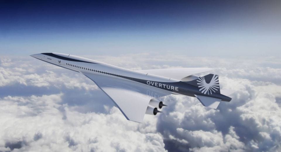 XB-1 supersonic aircraft in flight above clouds.