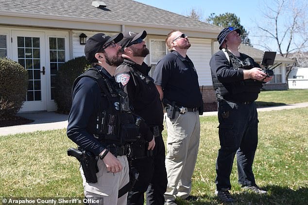 The Arapahoe County Sheriff¿s Office, based in Centennial, Colorado, has been using the robotic flying devices since 2017. (pictured: officers testing out a drone)