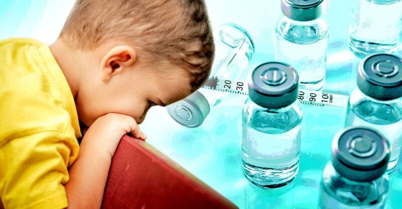 little boy overlooking vaccine bottles