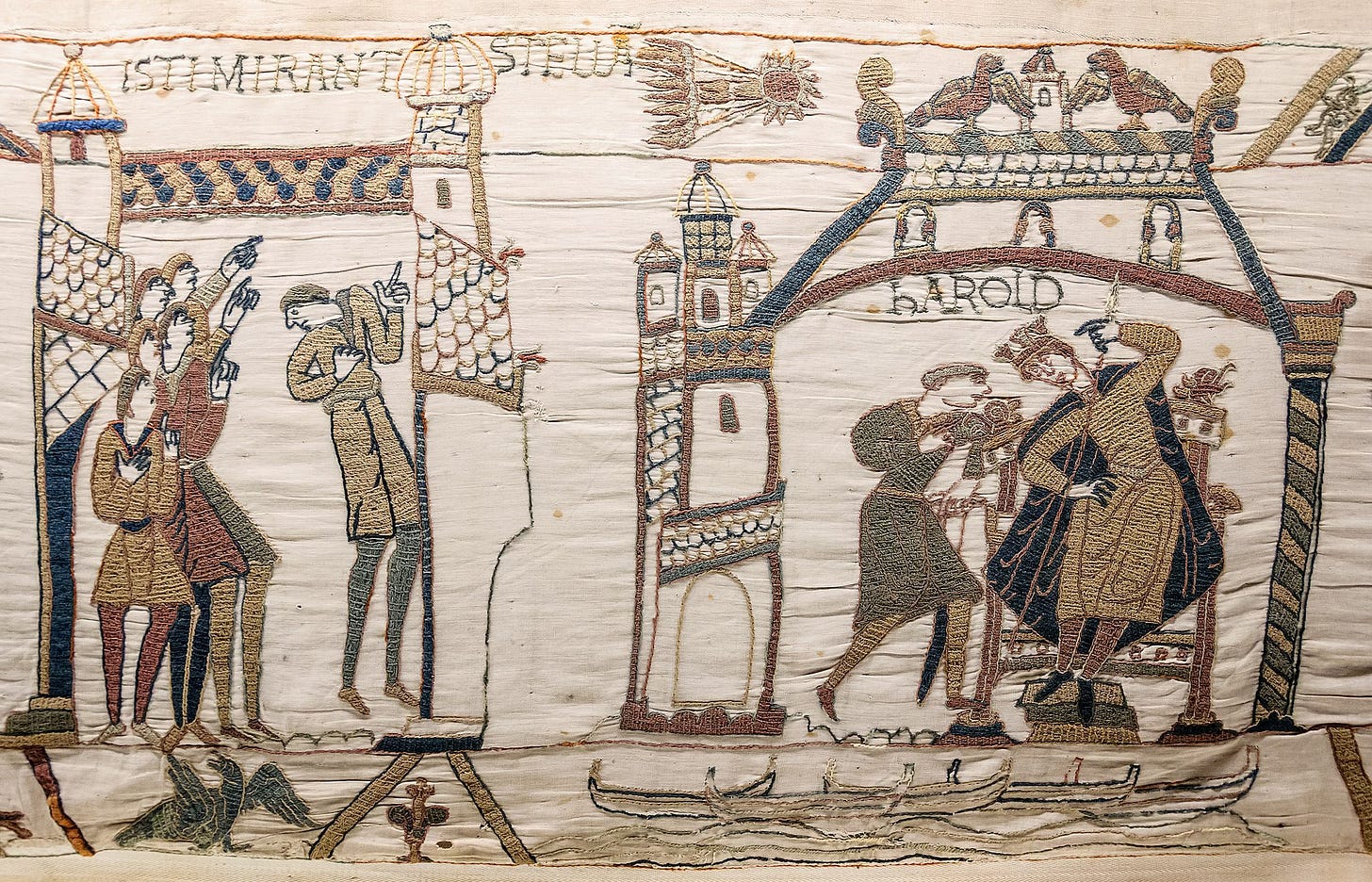 The Bayeux Tapestry. A panel embroidered with the image of men staring up at Halley's Comet while Harold seizes the English throne.