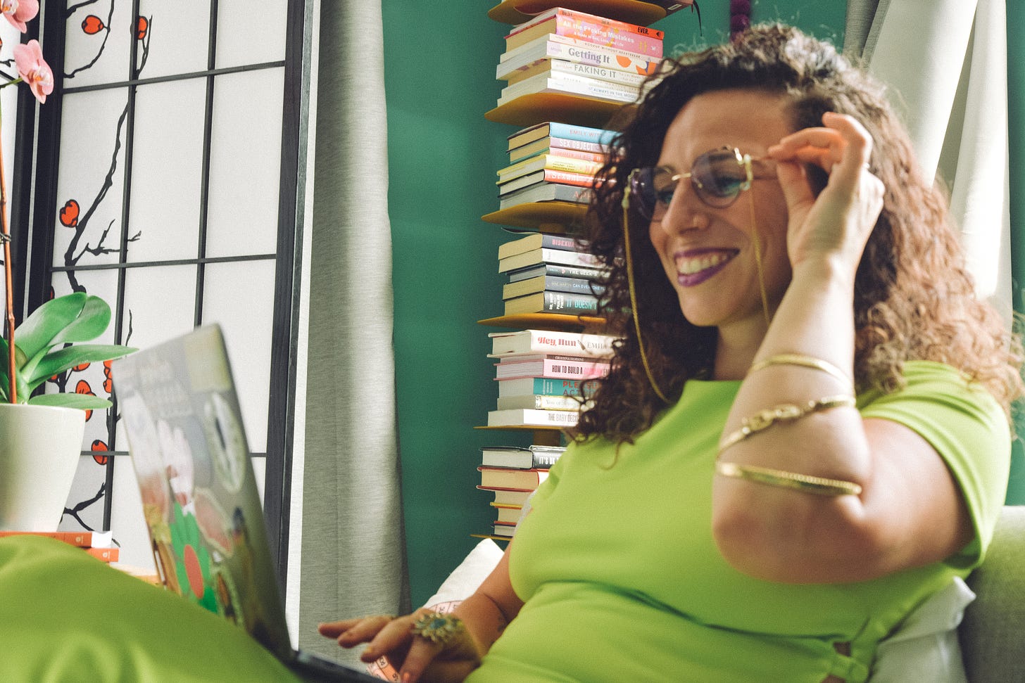 Dry Humping author Tawny Lara smiling looking at her laptop