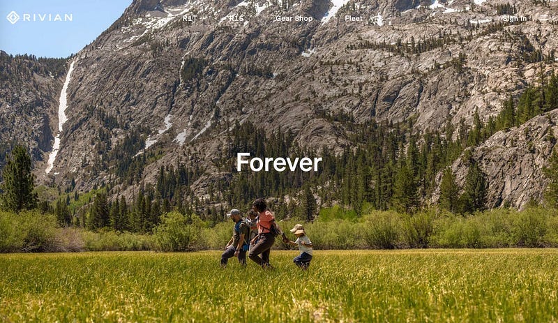 Screenshot of Rivian’s website. It’s a family hiking in nature with one word: Forever. There is no imagery of its product — cars.