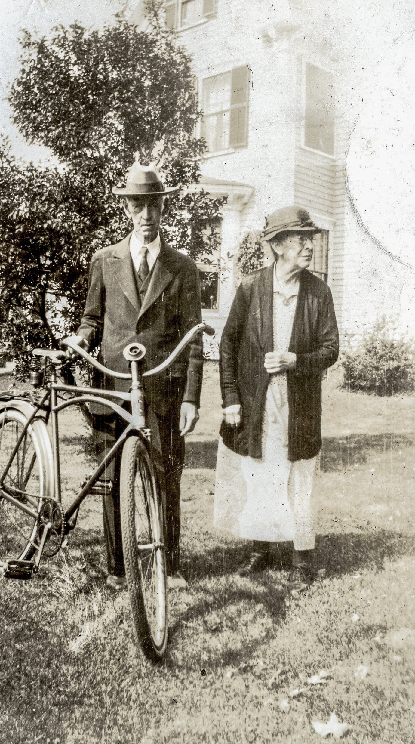 Man with bike and his wife