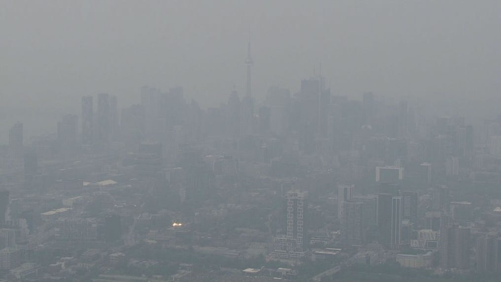 Toronto skyline barely visible because of massive pollution from wildfires.