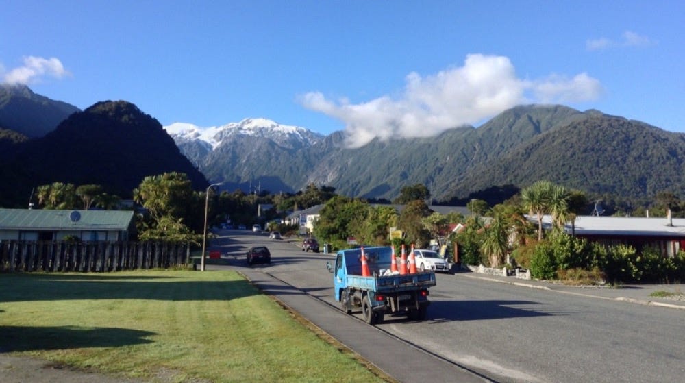 Quiet street with mountains behind