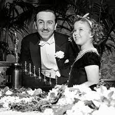 Iconic Cool - Shirley Temple presenting Walt Disney an Oscar for Snow White  and the Seven Dwarfs (1938). | Facebook