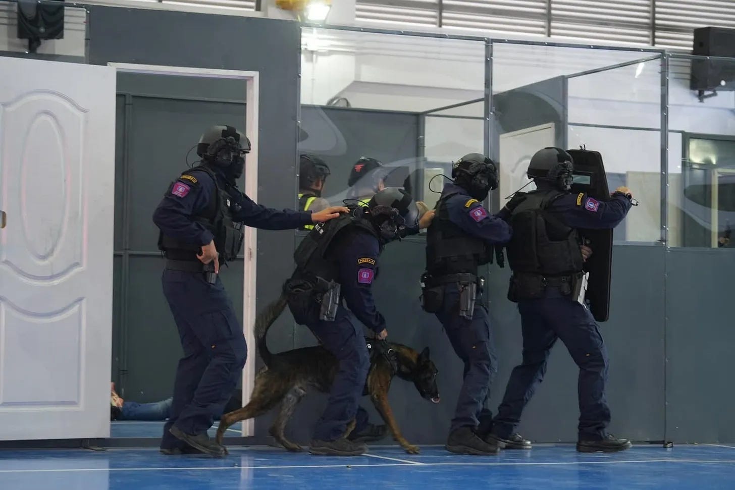 Thai policemen during an assault demonstration. Thai policemen during an assault demonstration.