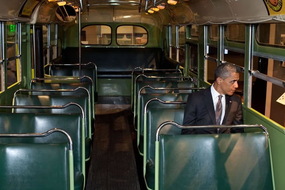 Barack Obama sits on the famed Rosa Parks bus at the Henry Ford Museum