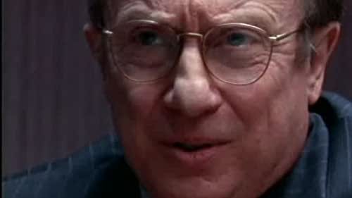 This still image from "Sideshow (Part 2)" shows a close-up shot of Independent Counsel William Dell (played by George Hearn). This still image from "Sideshow (Part 2)" shows a close-up shot of Independent Counsel William Dell (played by George Hearn).