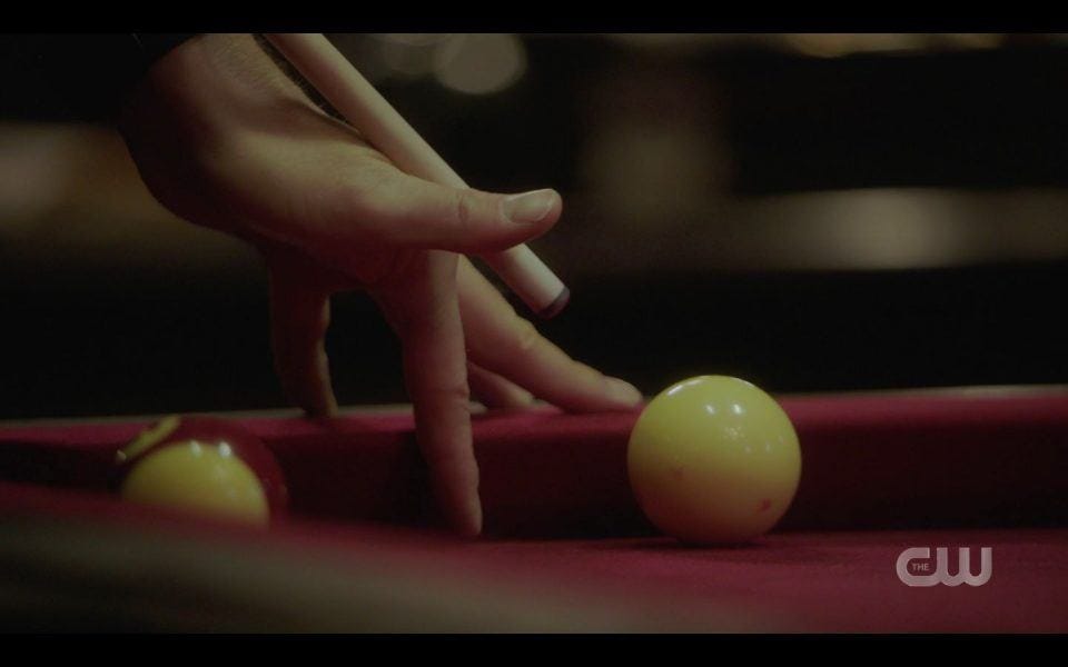 Dean Winchester making a hard pool shot