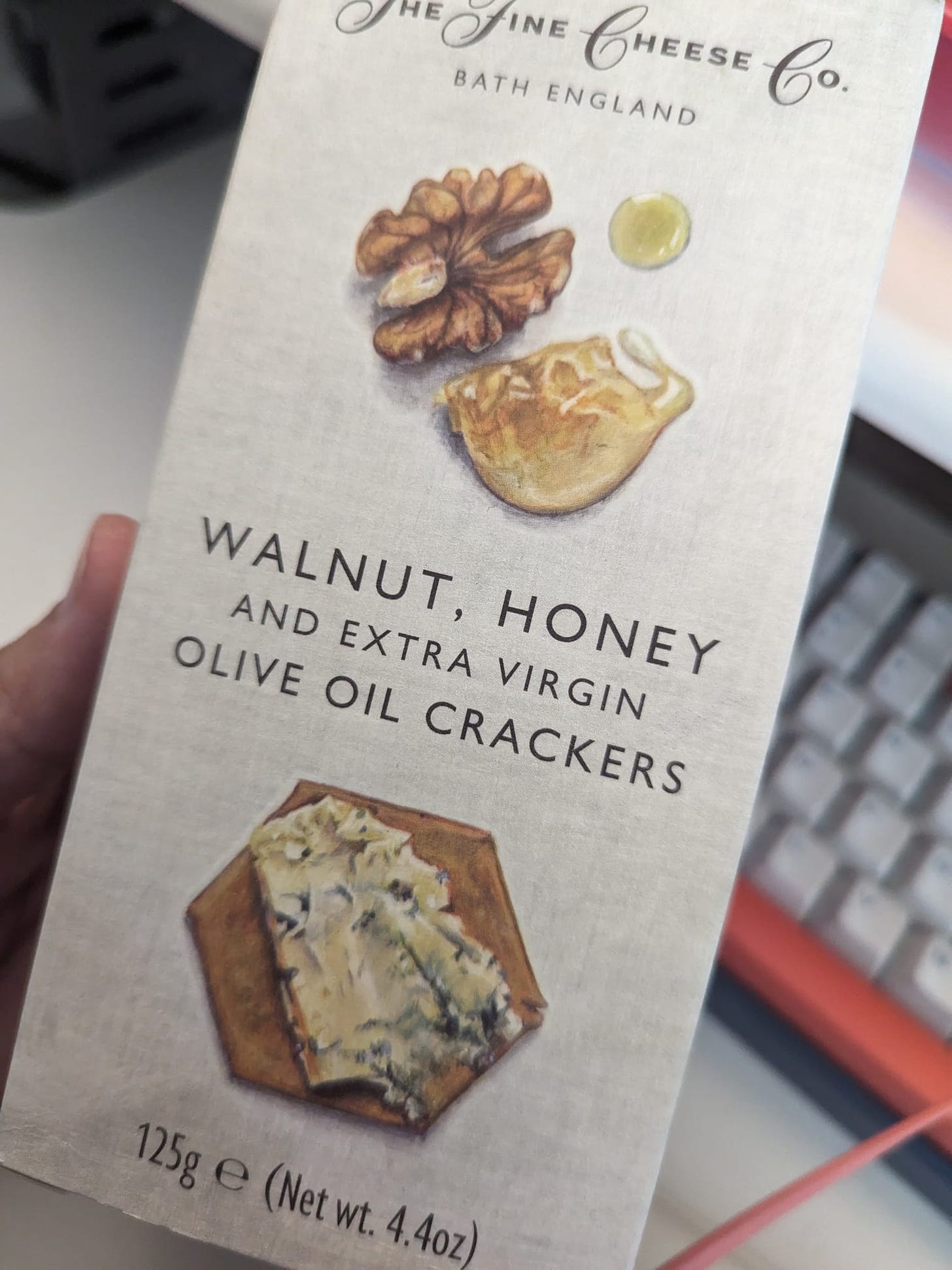 A box of Walnut, Honey and Extra Virgin Olive Oil Crackers by the Fine Cheese Co