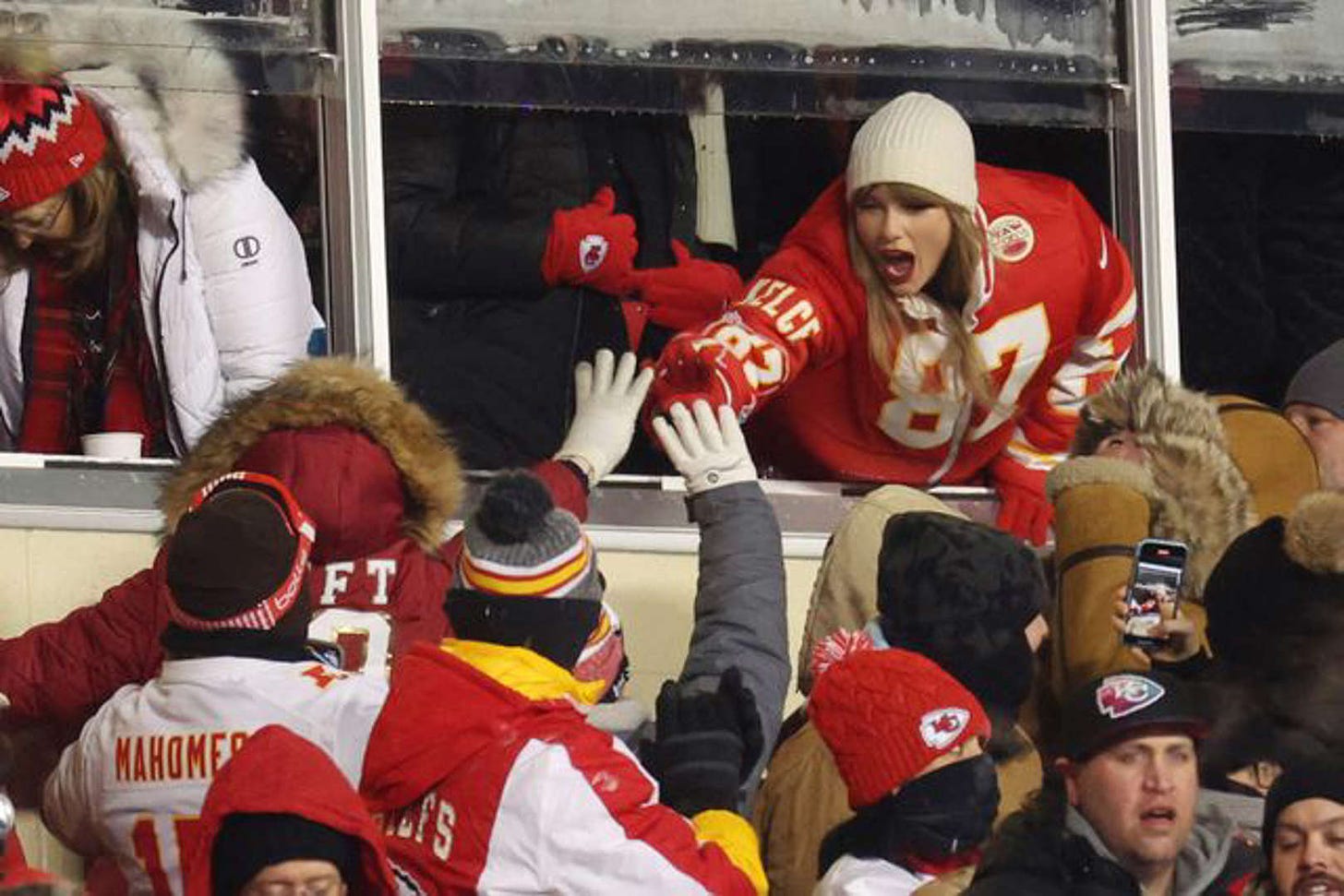 Taylor Swift attends the AFC Wild Card Playoffs between the Miami Dolphins and the Kansas City Chiefs