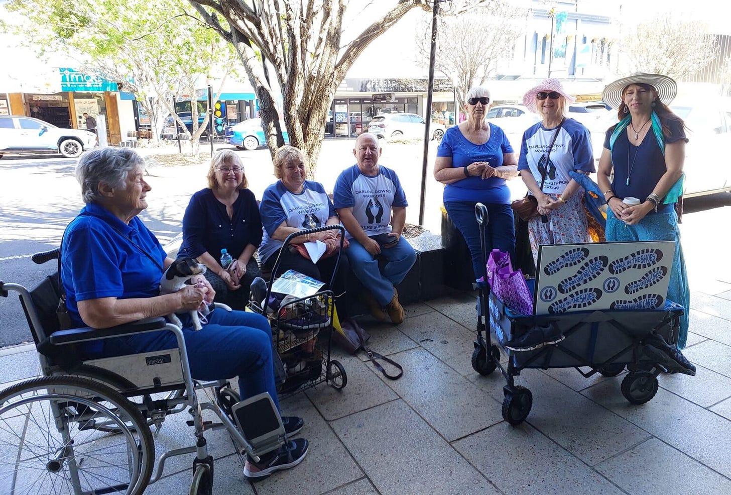 Unpaid carers and supporters (from left) Joan Flint, Toni Quarman, Sue Waters, George Helon, Maria Steele, Janelle McKenny and Nicolle McEwan invite people to walk in their shoes.