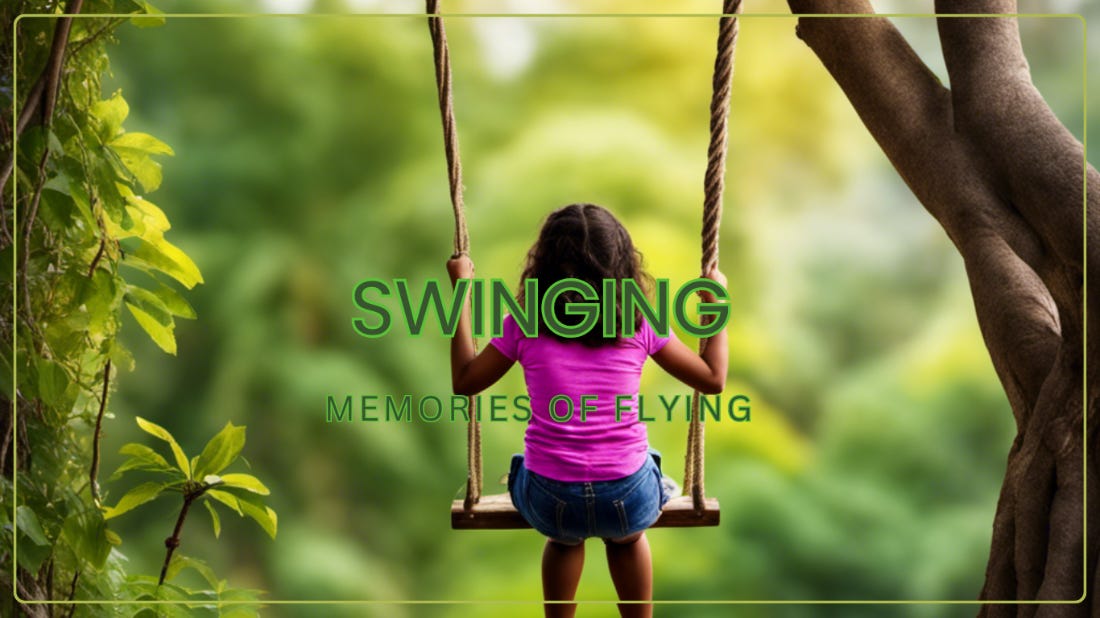 a child sitting on a swing in the jungle