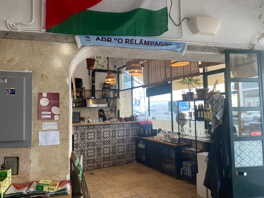 Kitchen area of a Palestinian restaurant with flag