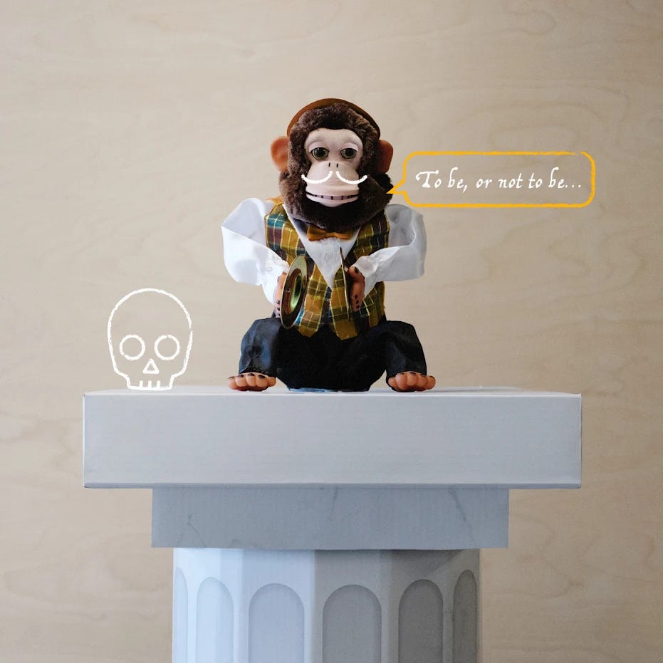 A toy monkey sittting on a pedestal with a speech bubble of it saying "To be or not to be" illustrated on top