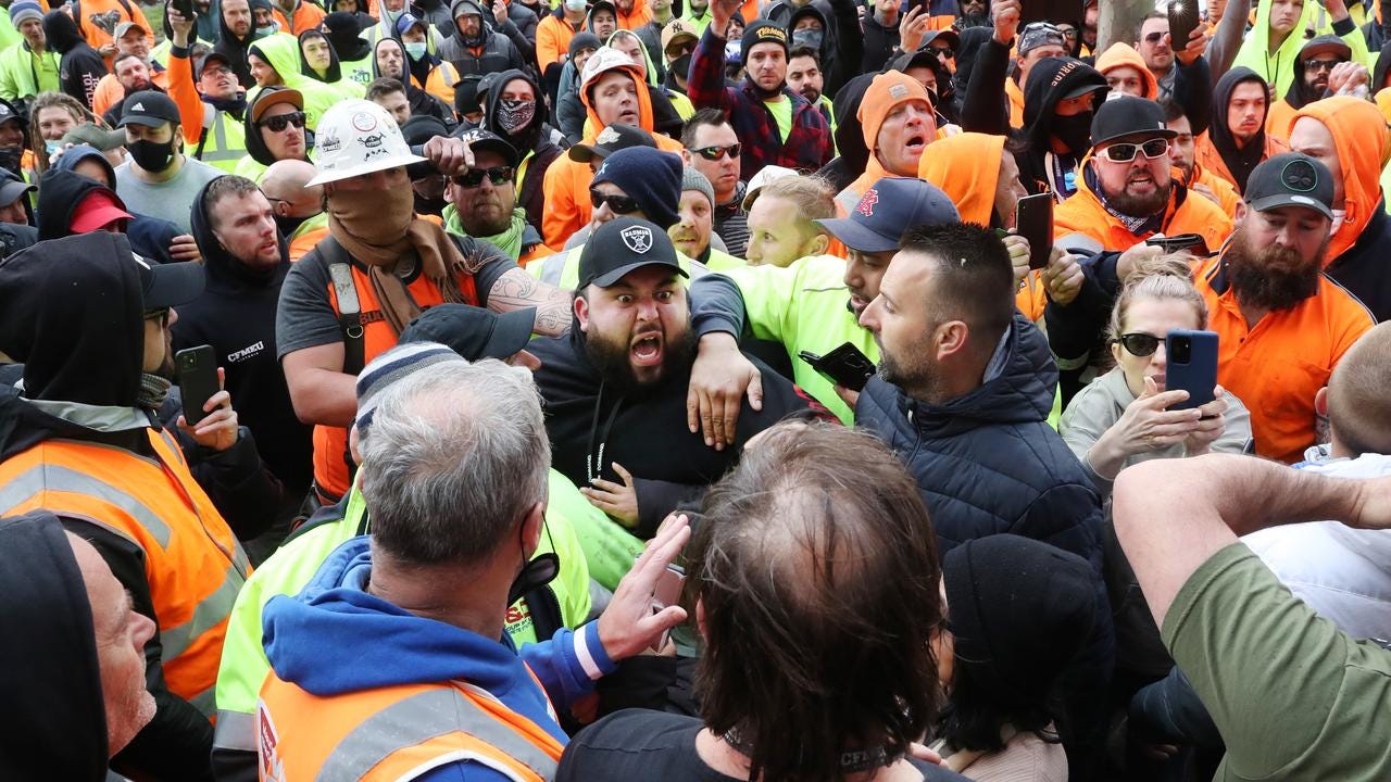 Protests outside the CFMEU offices in Melbourne turned violent as construction workers called on unions to "stand up or stand down". Picture: David Crosling