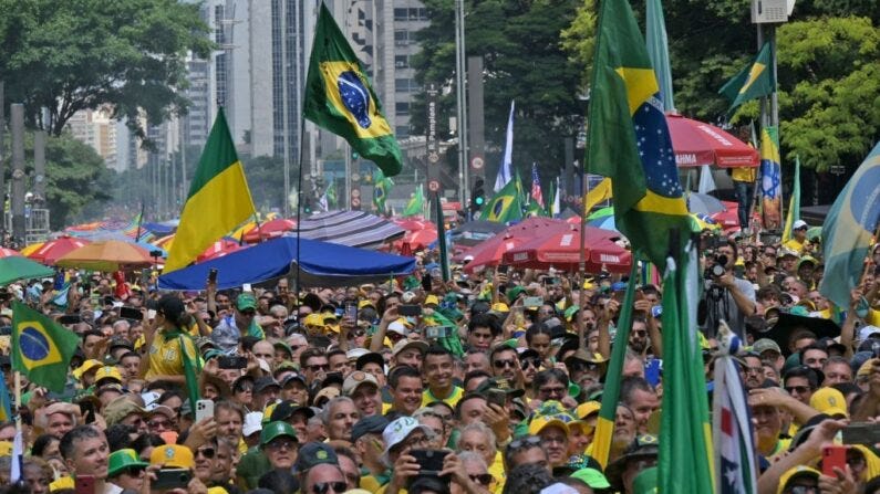 Supporters of former Brazilian President Jair Bolsonaro (2019-2022) take part in a rally in Sao Paulo, Brazil, on February 25, 2024, to reject allegations of a coup he allegedly plotted with his allies to remain in power after his failed bid for re-election in 2022. (Nelson Almeida/AFP via Getty Images)