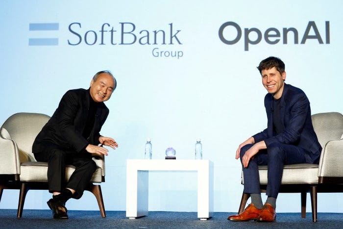 Masayoshi Son and Sam Altman at an AI business event. Masayoshi Son and Sam Altman at an AI business event.