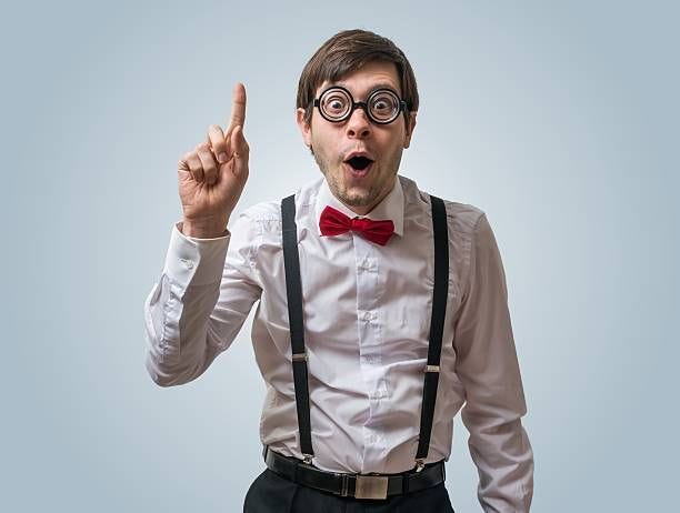 Funny nerd or geek have an idea. Funny nerd or geek have an idea and holds finger up. geek stock pictures, royalty-free photos & images