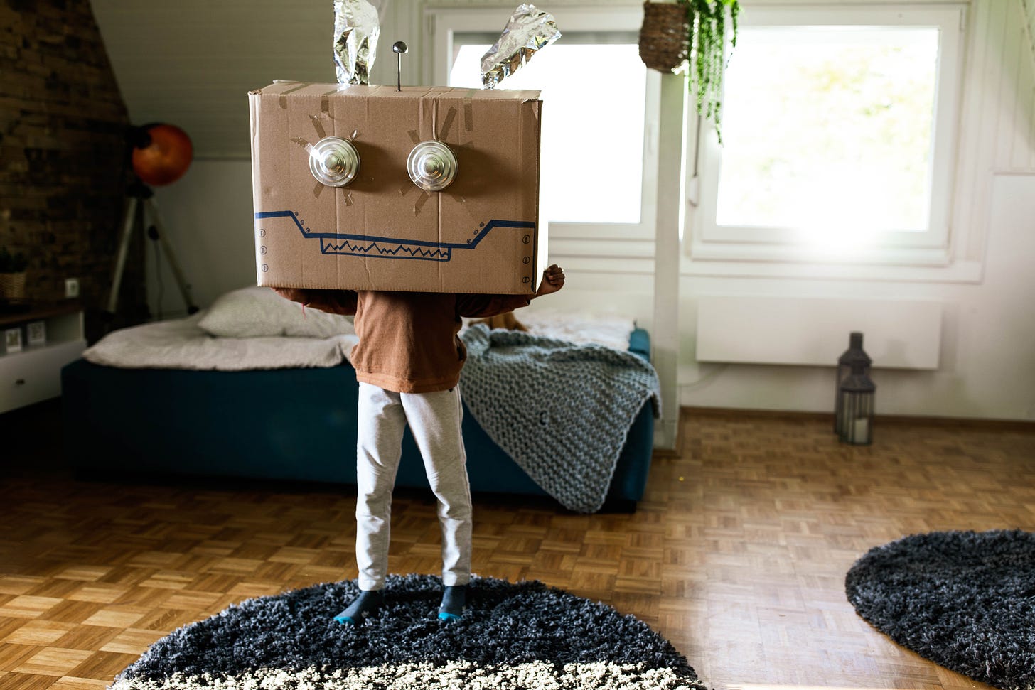 A child wearing a Halloween "boxtume" made from a cardboard box.
